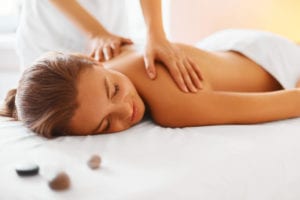woman gets massage at parlor